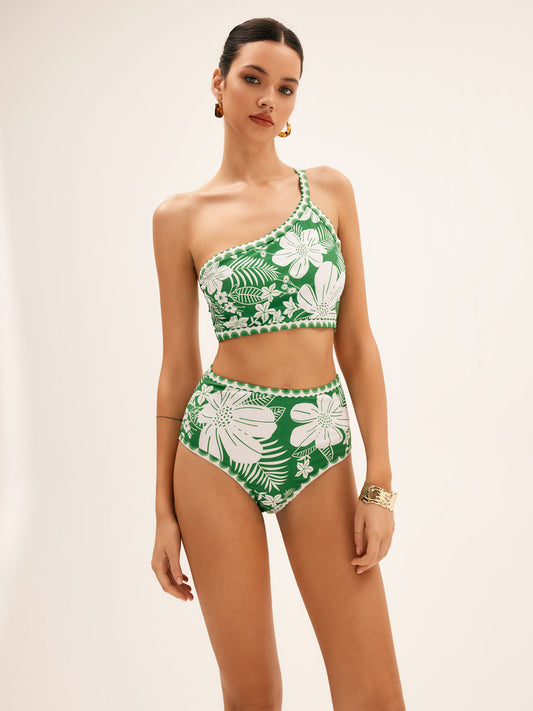 Deze trendy bikini combineert een elegante one shoulder top met een flatterende hoge taille slip, versierd met een prachtige bloemenprint.