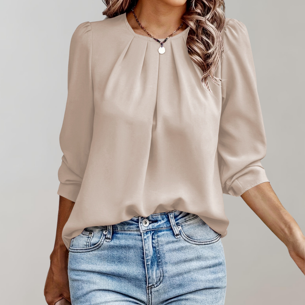 Gemaakt van luchtige, ademende stoffen, zorgt deze blouse ervoor dat je er altijd chic en comfortabel uitziet.