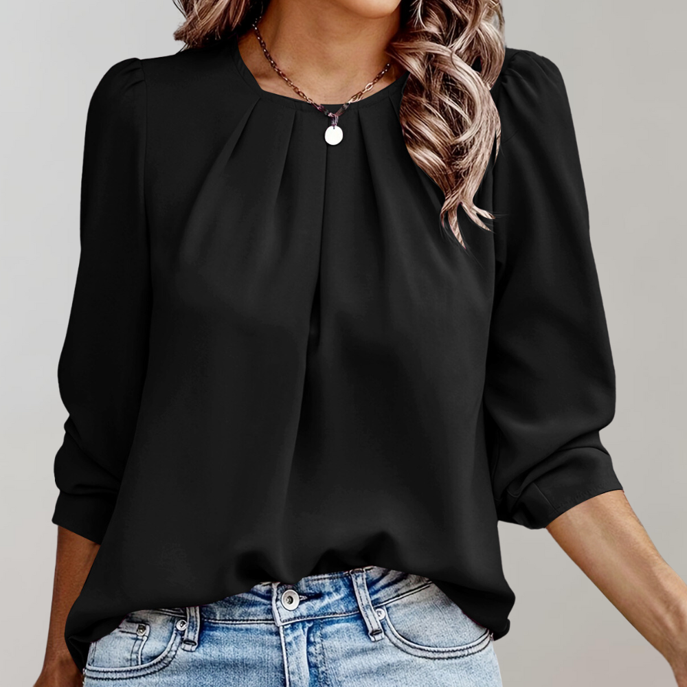 Gemaakt van luchtige, ademende stoffen, zorgt deze blouse ervoor dat je er altijd chic en comfortabel uitziet.