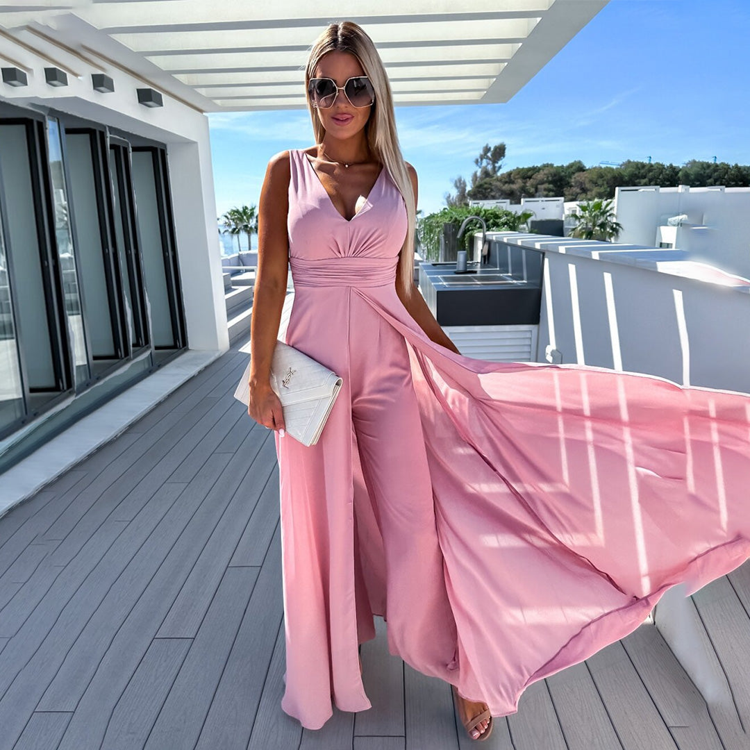 Deze veelzijdige jumpsuit gewaad is ontworpen met een chique uitstraling en biedt het ultieme gemak en verfijning voor allerlei zomerse gelegenheden.