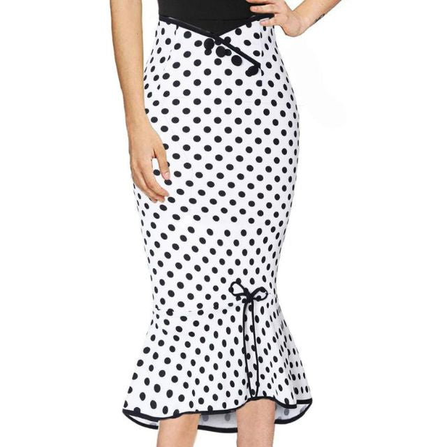 Deze elegante rok met een tijdloze stippenprint is perfect voor warme dagen en biedt moeiteloze charme en comfort.